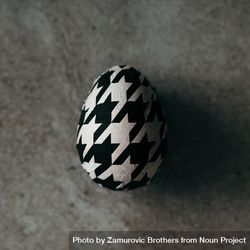 Houndstooth egg top view on stone background 5RdeDb