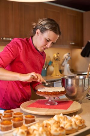 Concentrated woman making dessert at home