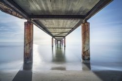 Pier or jetty seen from below, beach and sea in Marina di Pietrasanta, Versilia Tuscany Italy