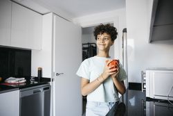 Girl drinking a cup of milk