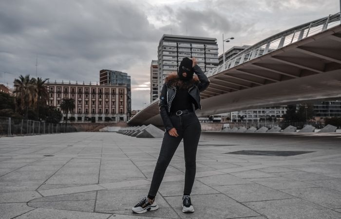 Woman in balaclava and leather jacket