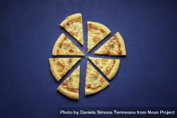 4 cheese pizza slices on velvet background 0y9JG0