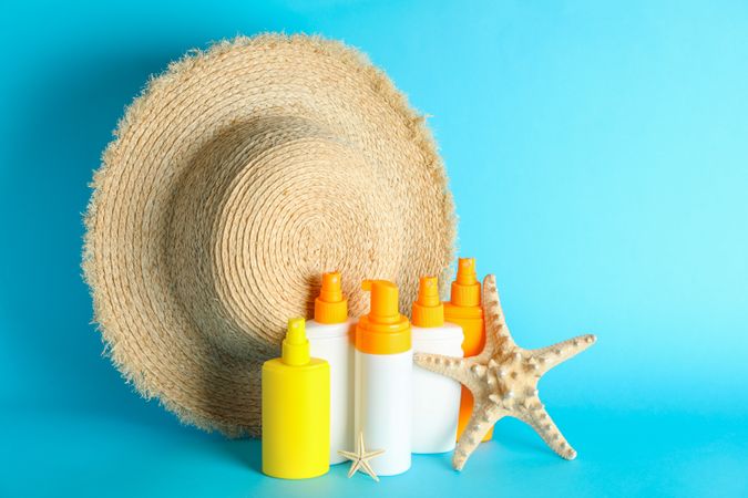 Summer vacation accessories on color background, space for text. Safe tan