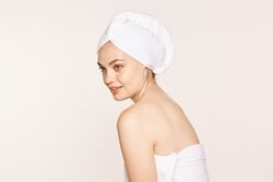 female with radiant body after cosmetic procedure