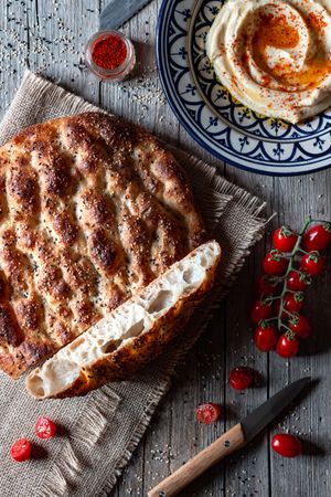 Ramazan pidesi near spices and tomatoes