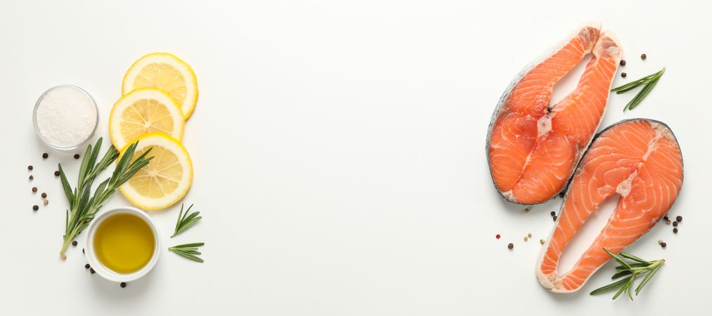 Composition with salmon meat and spices on light background, top view