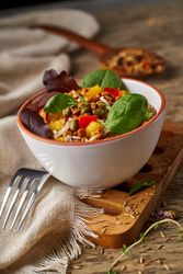 Bright vegetables with lentils and spinach in bowl