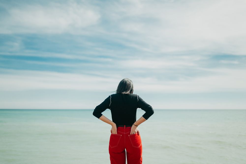 Anonymous female looking at sea