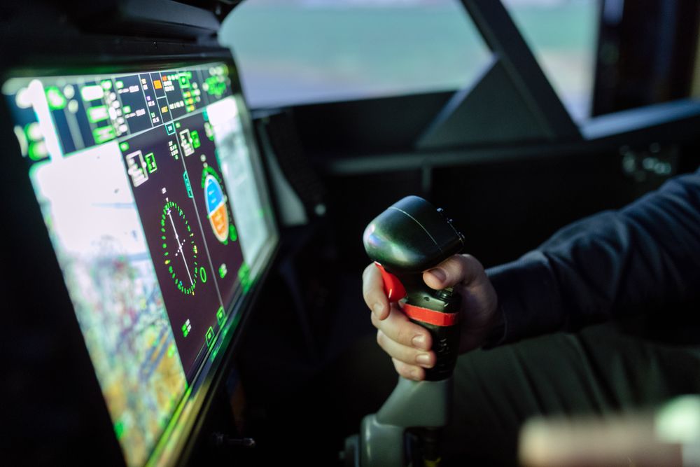 Cropped image of person in control room