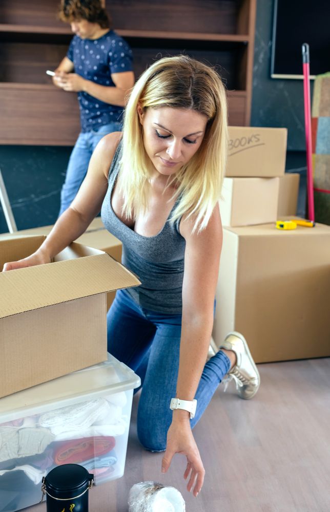 Woman unpacking moving boxes
