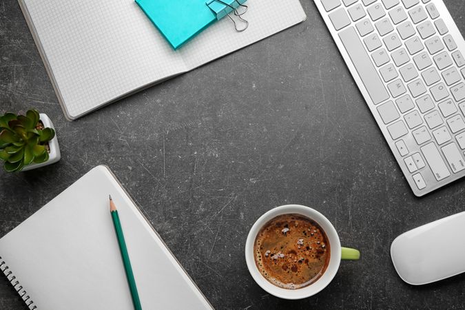 Cup of Coffee with Office Supplies on the Table