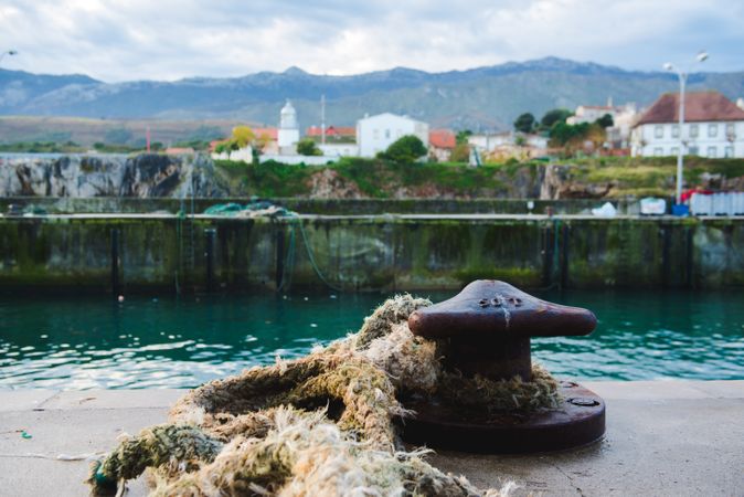 Old rope near water in harbor