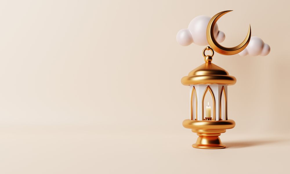 Lantern with lit candle with crescent moon, copy space