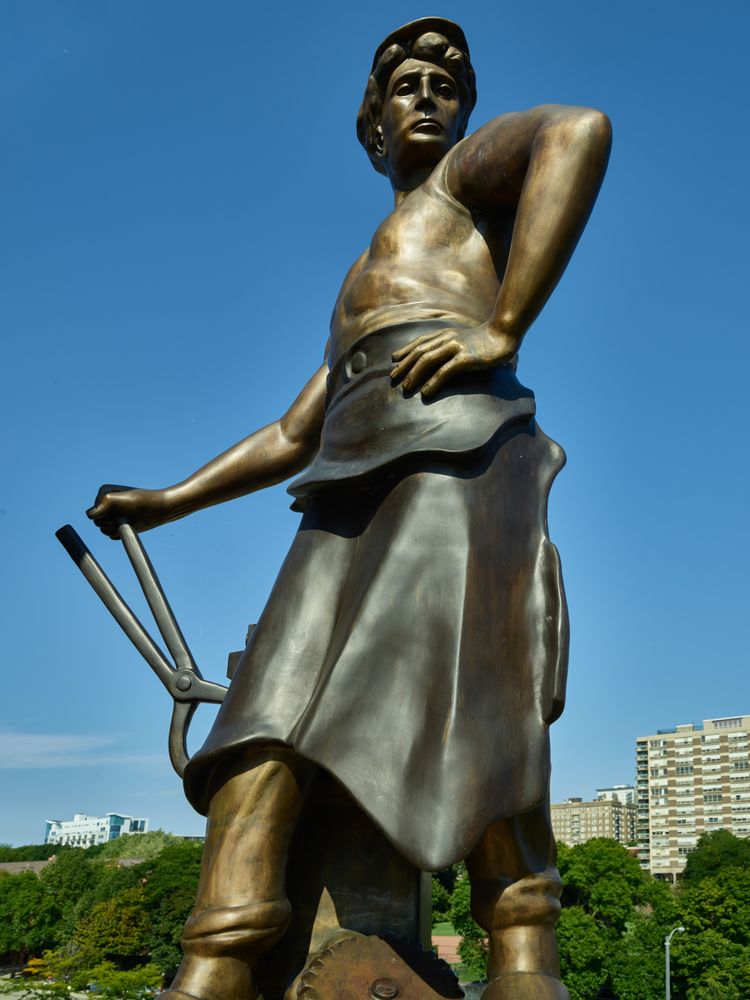 Bronze statue of woman in sculpture garden at the Grohmann Museum,  Milwaukee, Wisconsin