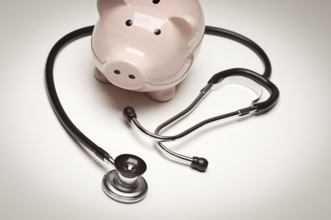 Piggy Bank and Stethoscope with Selective Focus