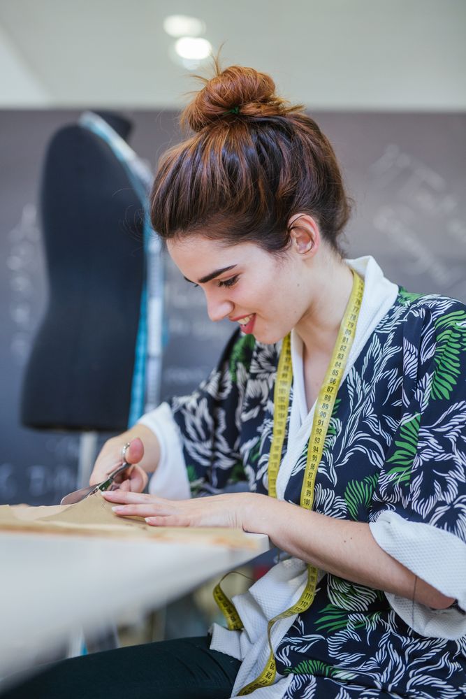 Woman in a sewing school