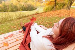 Woman relaxing on park bench enjoying the view