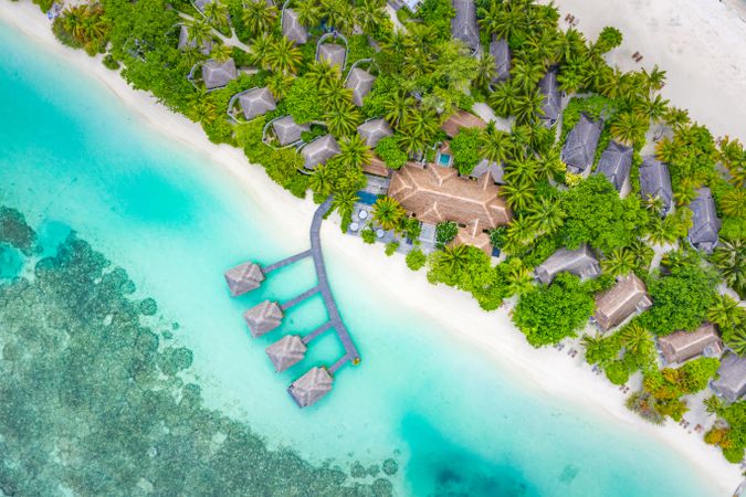 Overhead shot of various bungalows on an island resort