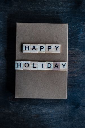 Happy holiday card on navy table