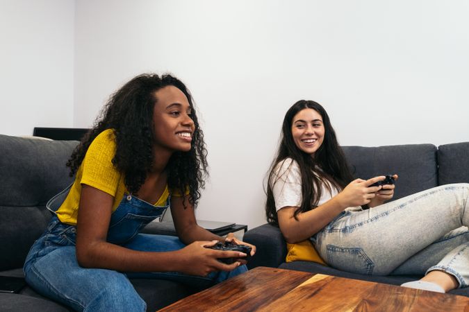 Friends bonding over console gaming in living room