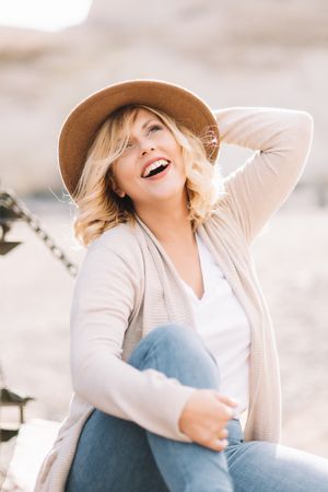 Cheerful woman having rest in countryside