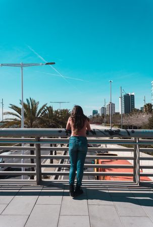 Teen girl walking happily through the streets.