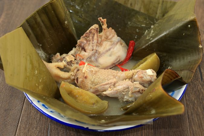 Garang Asem Ayam or Steamed  Tangy Chicken wrapped in Banana Leaves