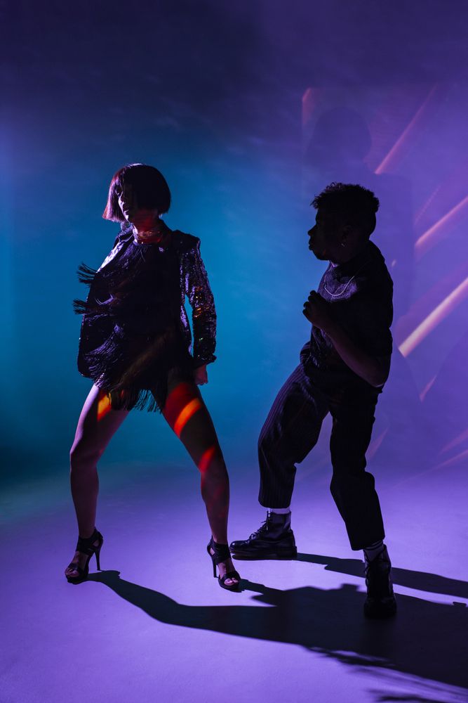 young dancers near smoke