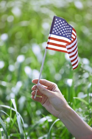 Woman holding US flag