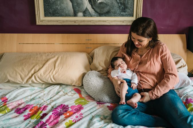 Woman hugging smiling daughter