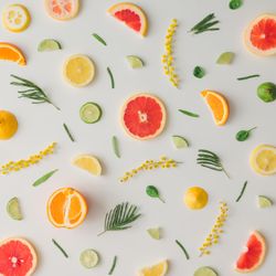 Colorful vegetable pattern made of lemon, grapefruit, lime and yellow flowers