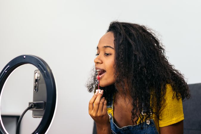 Beauty blogger promoting makeup on social media