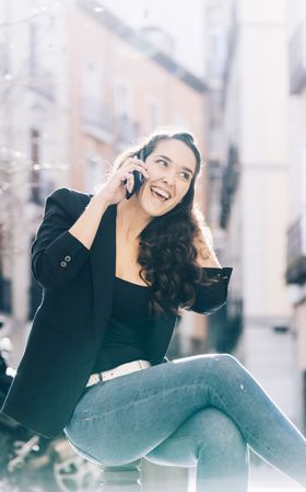 Young female walking with smartphone