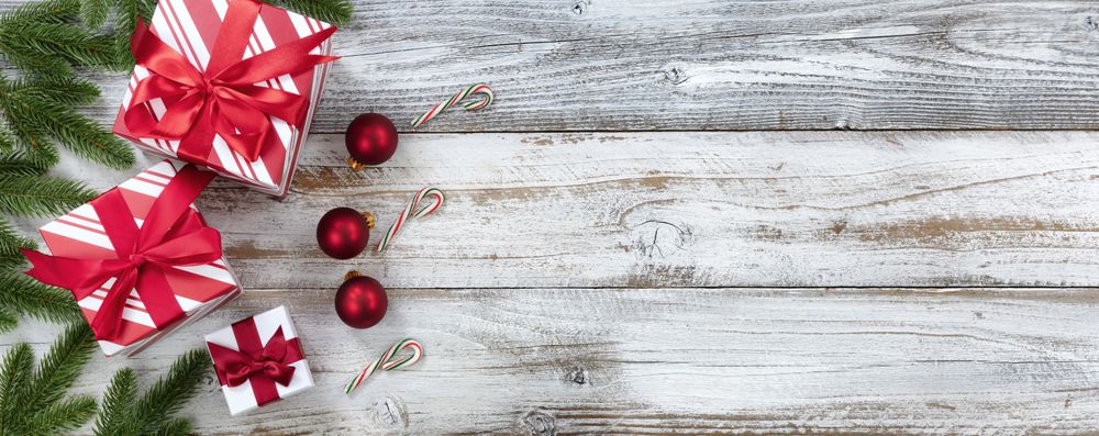 Merry Christmas holiday border on weathered wooden background