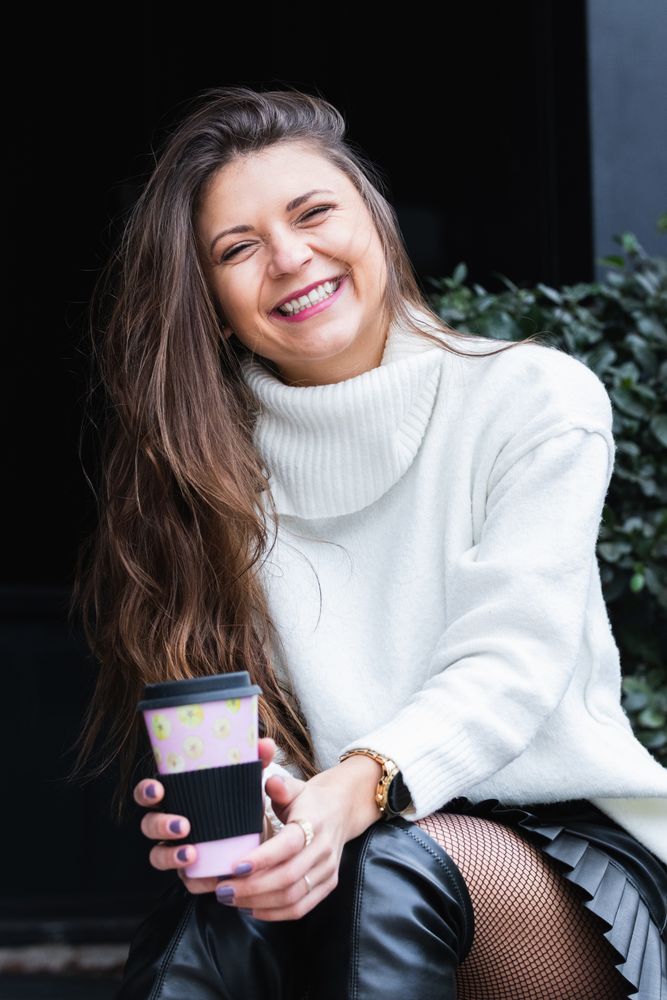 Smiling woman with cup of coffee