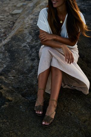 young woman posing on rock