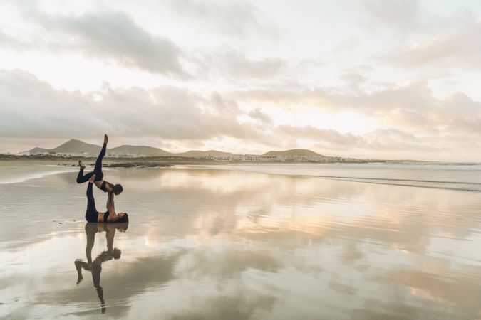 Women exercising near sea