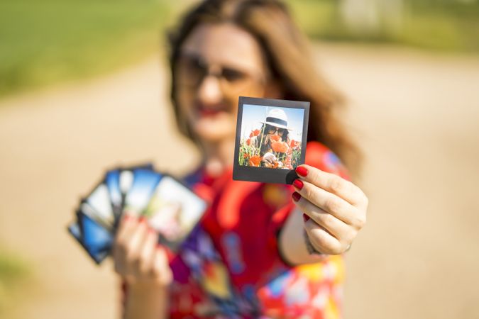 Young woman showing summer photos
