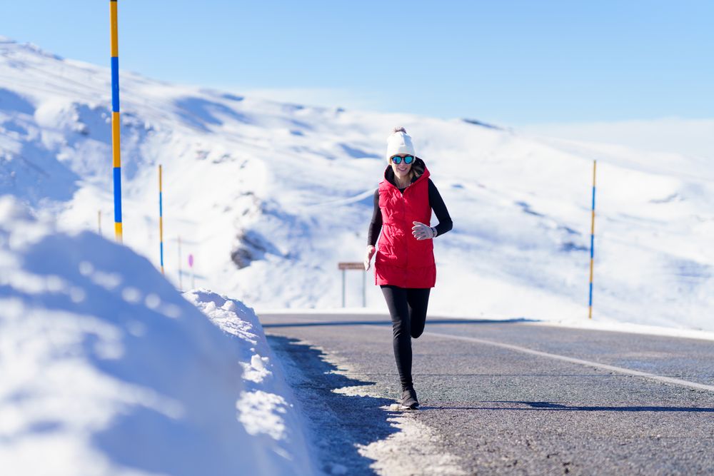 Seeing woman running on road in the mountains