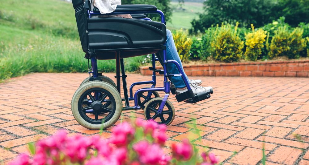 Unrecognizable older woman in a wheelchair