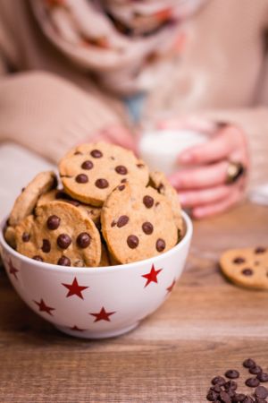 Chocolate chip cookies on stars bowl over a table