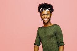 Colorful studio portrait of a young man smiling