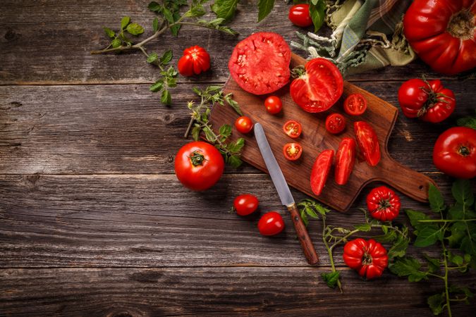 Fresh ripe garden tomatoes on wooden table