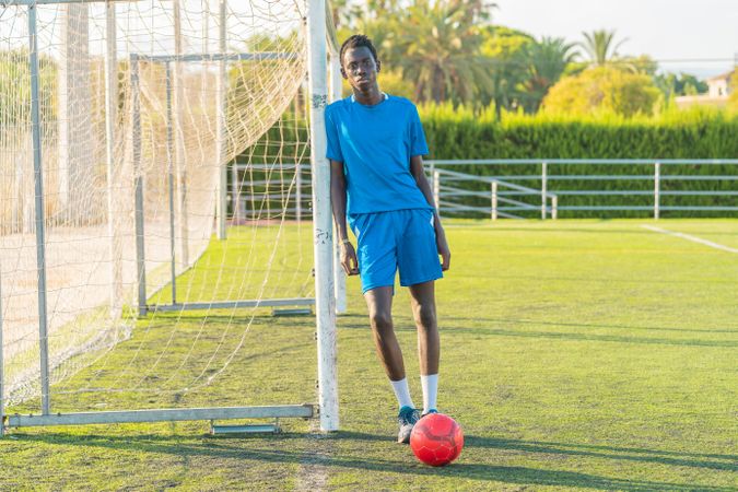 Black teenager on football field