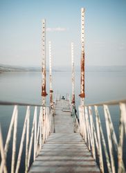 Rusty pier near calm sea