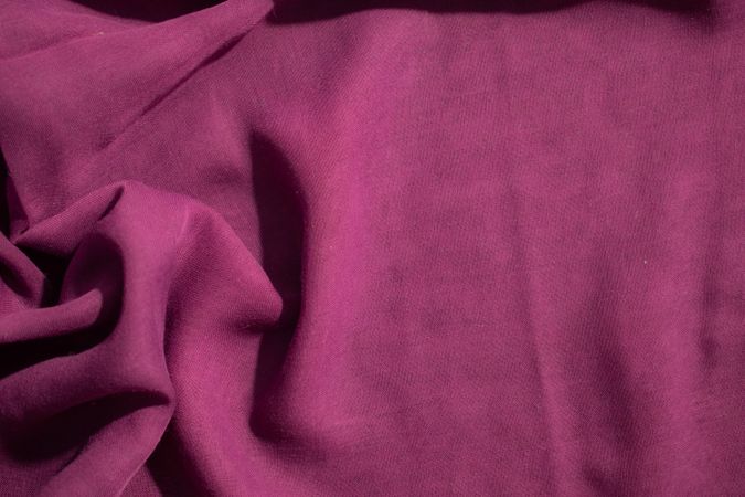 Soft purple fabric wavy crumpled background abstract with copy space