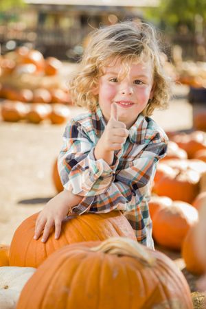 Male Child Gives Thumbs Up  at Pumpkin Patch.