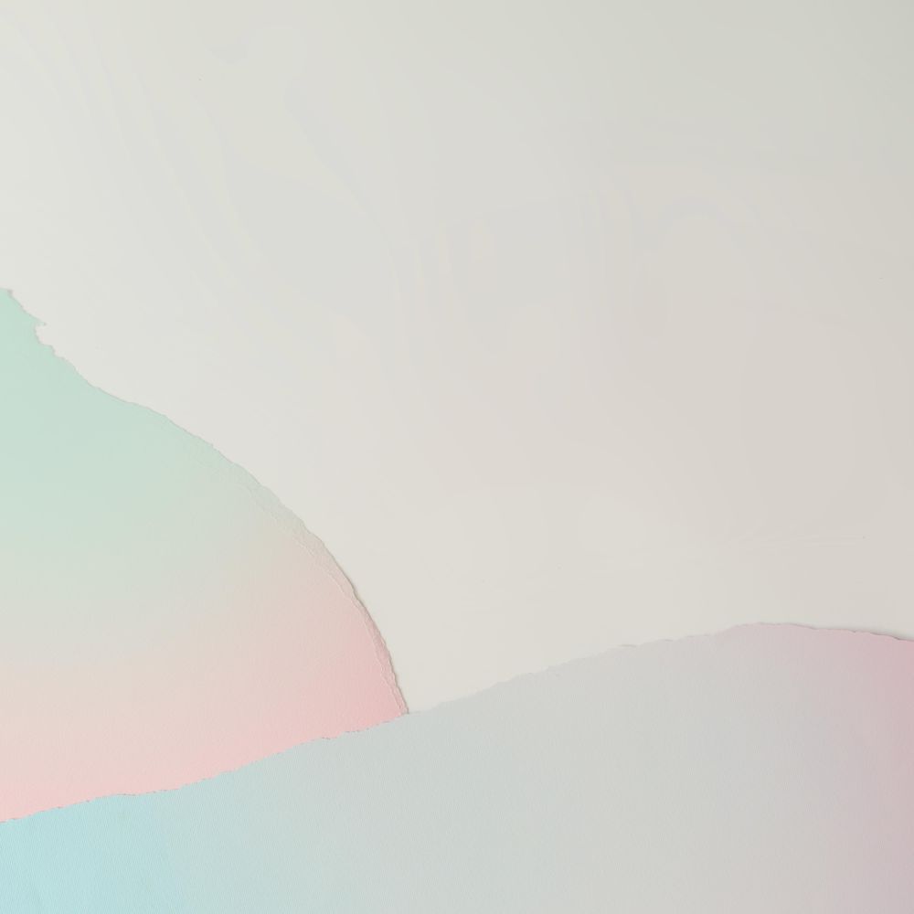 Pieces of ripped pastel colored paper in pattern