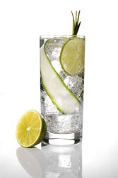 Tasty cocktail in glass with lemon
