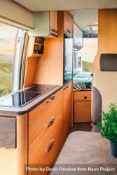 Inside of motorhome camper with door open to scenic view, vertical bY2B10